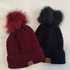 2 NWOT knit hats with faux fur on top. Black and burgundy